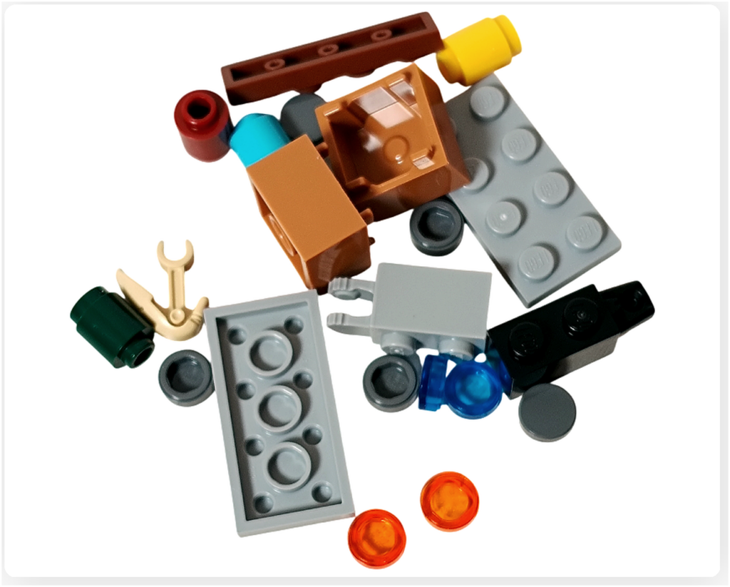 LEGO スター・ウォーズ 75418 アドベントカレンダー2025のストレージシェルフ用パーツ。 グレーやブラウンのプレート、小型パーツやクリアパーツが含まれた構成が確認できる。