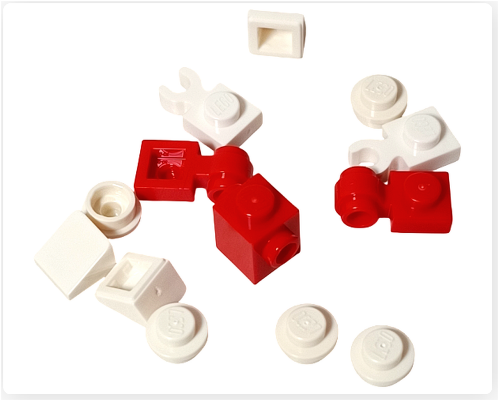 LEGO スター・ウォーズ 75418 アドベントカレンダー2025のホリデー・マウス・ドロイド用パーツ。 赤と白のブロックや丸型パーツが含まれ、小型ドロイドを組み立てる構成が確認できる。