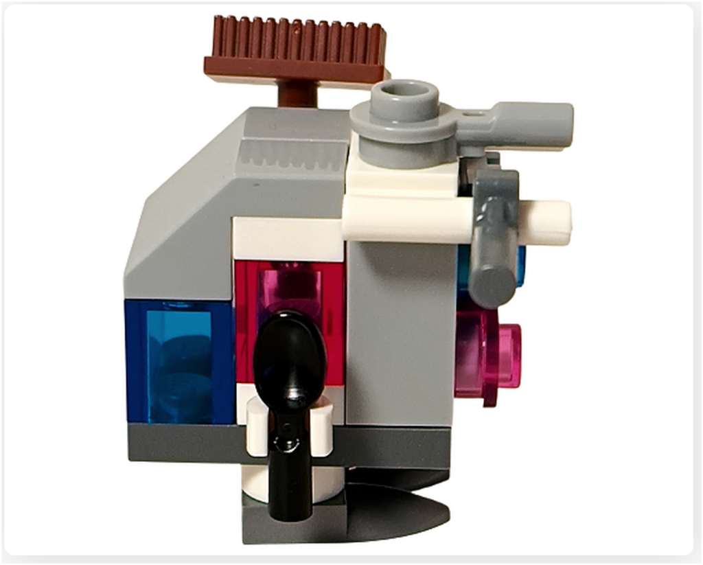 LEGO スター・ウォーズ 75418 アドベントカレンダー2025に含まれるゴンク・ドロイドのミニビルド右側面写真。側面の工具パーツと、青およびピンクの発光パーツ配置が確認できる。