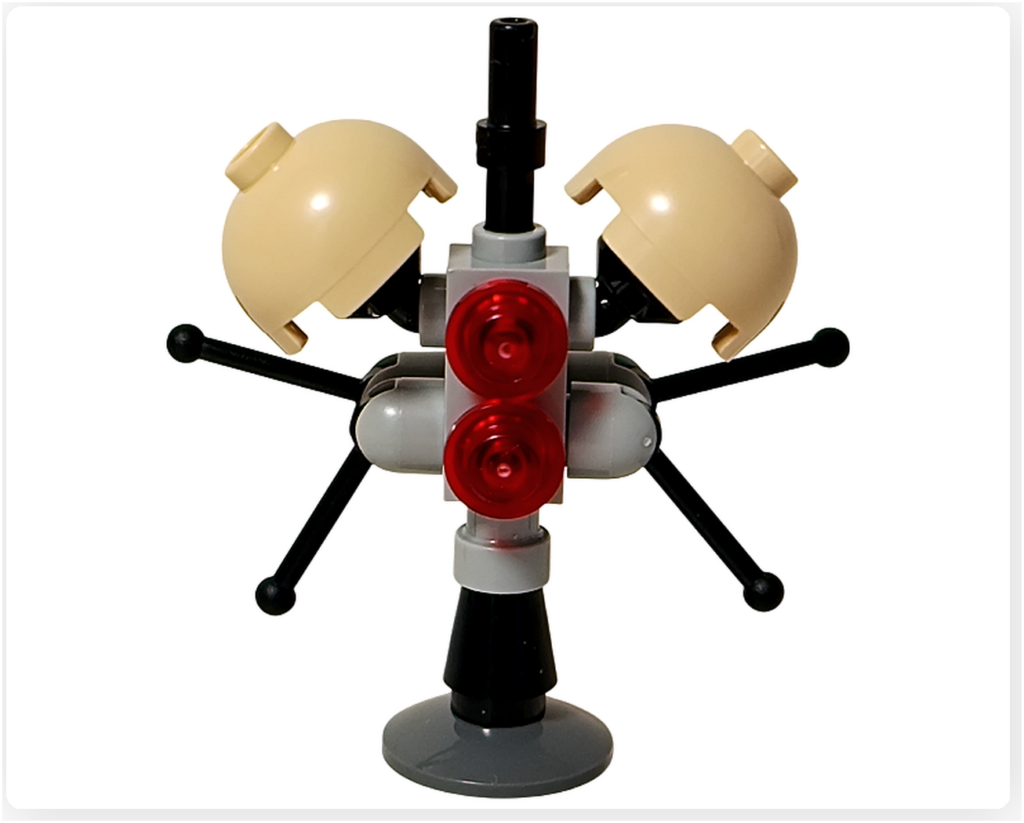 LEGO スター・ウォーズ 75418 アドベントカレンダー2025に収録されたバズ・ドロイドを正面から撮影した写真。中央のグレーの支柱に赤い円形パーツを2つ備え、左右に黒いアームとベージュの半球状パーツが展開された構成が確認できる。