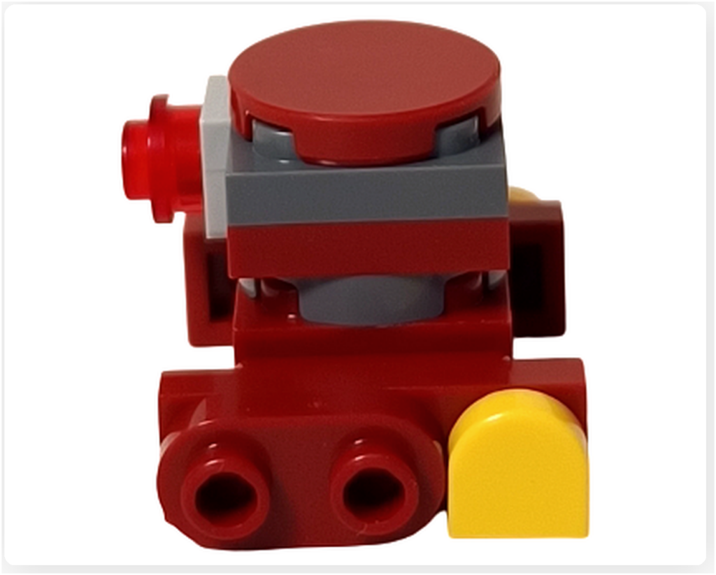 LEGO スター・ウォーズ 75418 アドベントカレンダー2025収録のB2EMOを左側面から撮影。赤とダークグレーの積層構造に加え、前面側の丸穴パーツと後方の黄色パーツ配置が確認でき、左右非対称な構成が分かる。