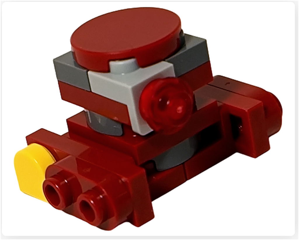 LEGO スター・ウォーズ 75418 アドベントカレンダー2025収録のB2EMOを右側面斜め前から撮影。赤いボディに前面の丸穴パーツ、側面の赤色ライトパーツ、後方の黄色パーツが同時に確認でき、立体的な構造が分かる。
