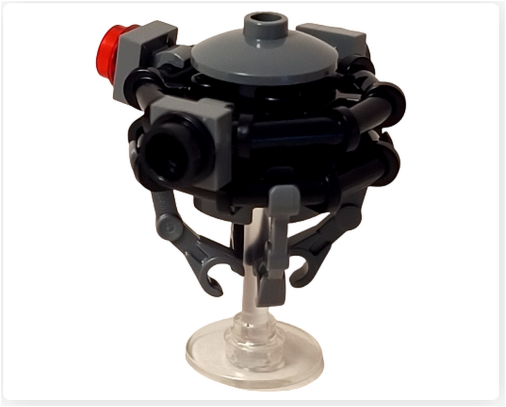 レゴ スター・ウォーズ 75418に登場するプローブ・ドロイドを、アームを下げた待機状態で撮影した写真。円盤状の本体と下向きのアーム構成が、索敵前の静止した様子を表現している。