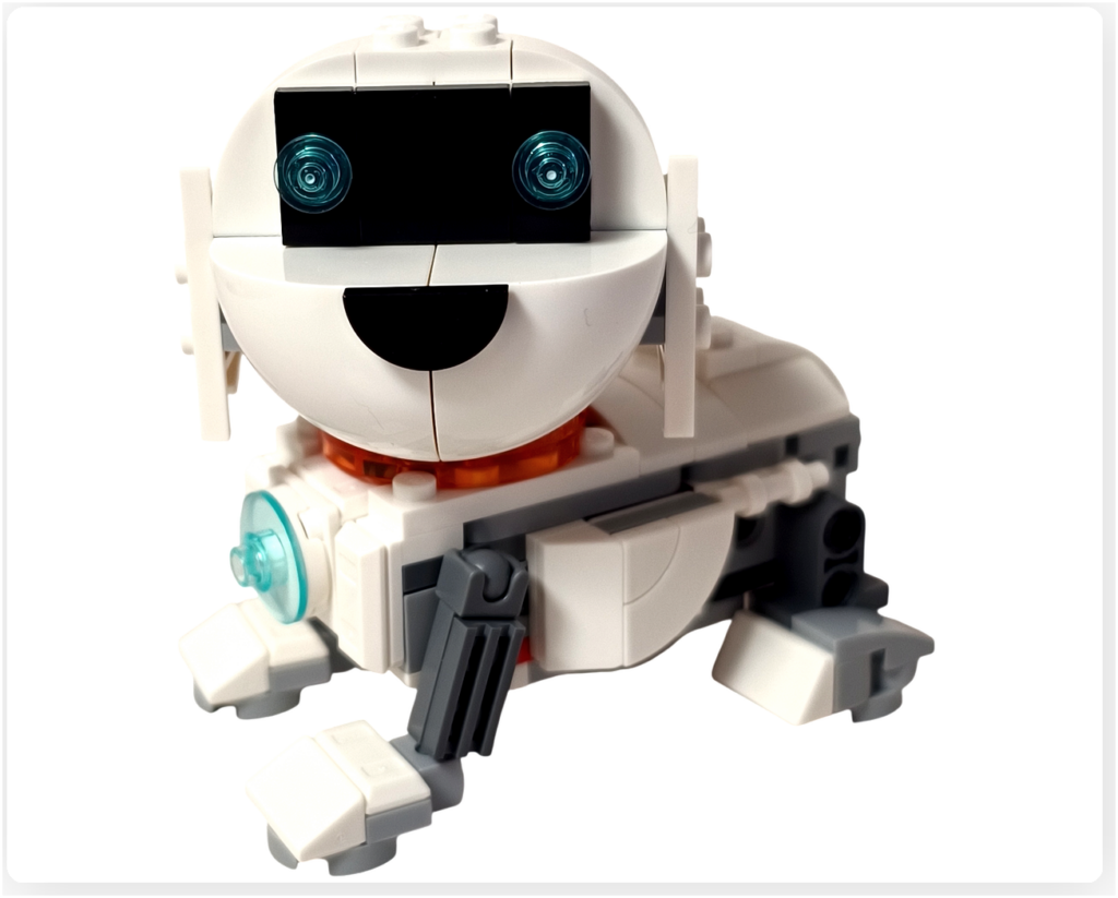 レゴ 31164 うちゅうロボット 「うちゅう犬」が起き上がってこちらを振り向いている様子。青い目のパーツが印象的で、白とグレーの機体が正面を向いているシーン。
