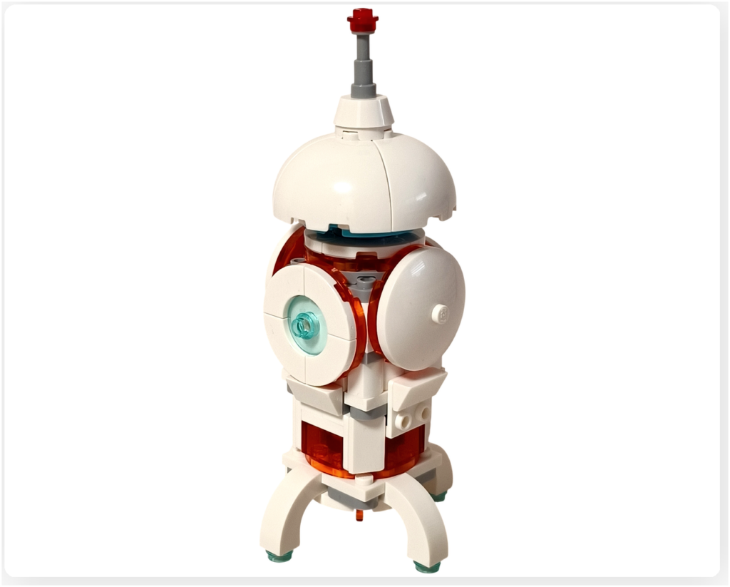 レゴ 31164 うちゅうロボット 「うちゅうロケット」を正面から撮影した写真。白とクリアオレンジの機体が発射準備状態で立っている。